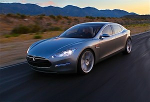 Tesla Model S Tesla Model S electric vehicle driving long distance in the desert